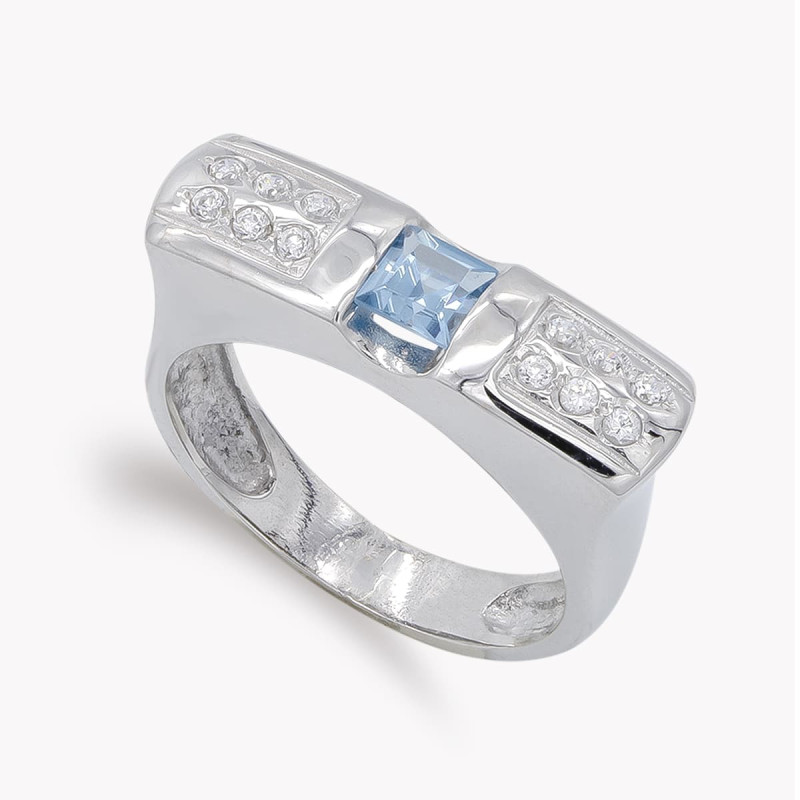 18K SORTIJA ORO BLANCO CIRCONITA  AGUAMARINA Y BLANCAS. ANCHO: 6,5 MM