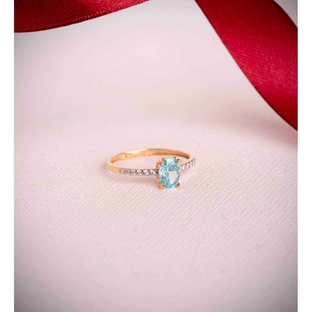 18K SORTIJA ORO BICOLOR TOPACIO NATURAL PARAIBA OVAL 7X5MM 0,93 QTS. Y CIRCONITAS