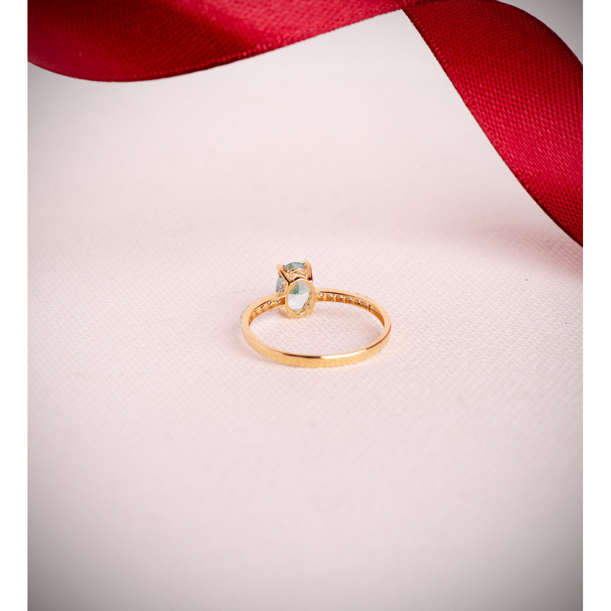 18K SORTIJA ORO BICOLOR TOPACIO NATURAL PARAIBA OVAL 7X5MM 0,93 QTS. Y CIRCONITAS