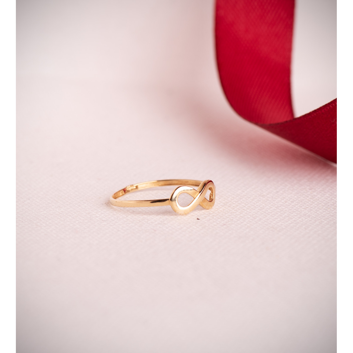 18K SORTIJA ORO AMARILLO LISA INFINITO CALADO DE 11X5 MM.